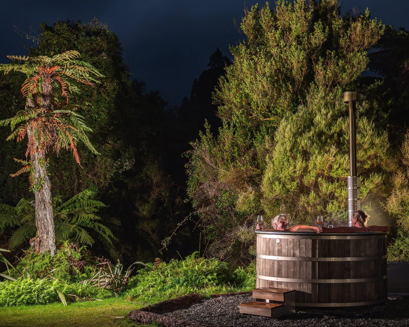 Retire gracefully to the wood-fired hot tubs at Waitai Lodge.