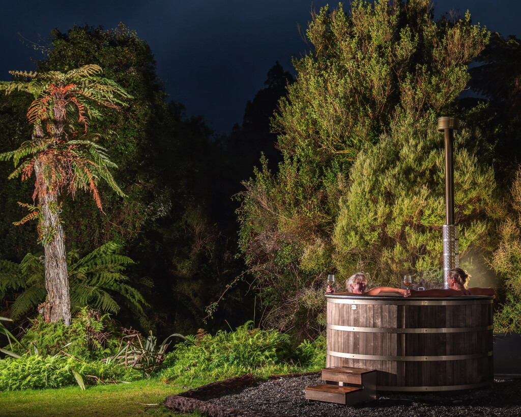 Retire gracefully to the wood-fired hot tubs at Waitai Lodge.