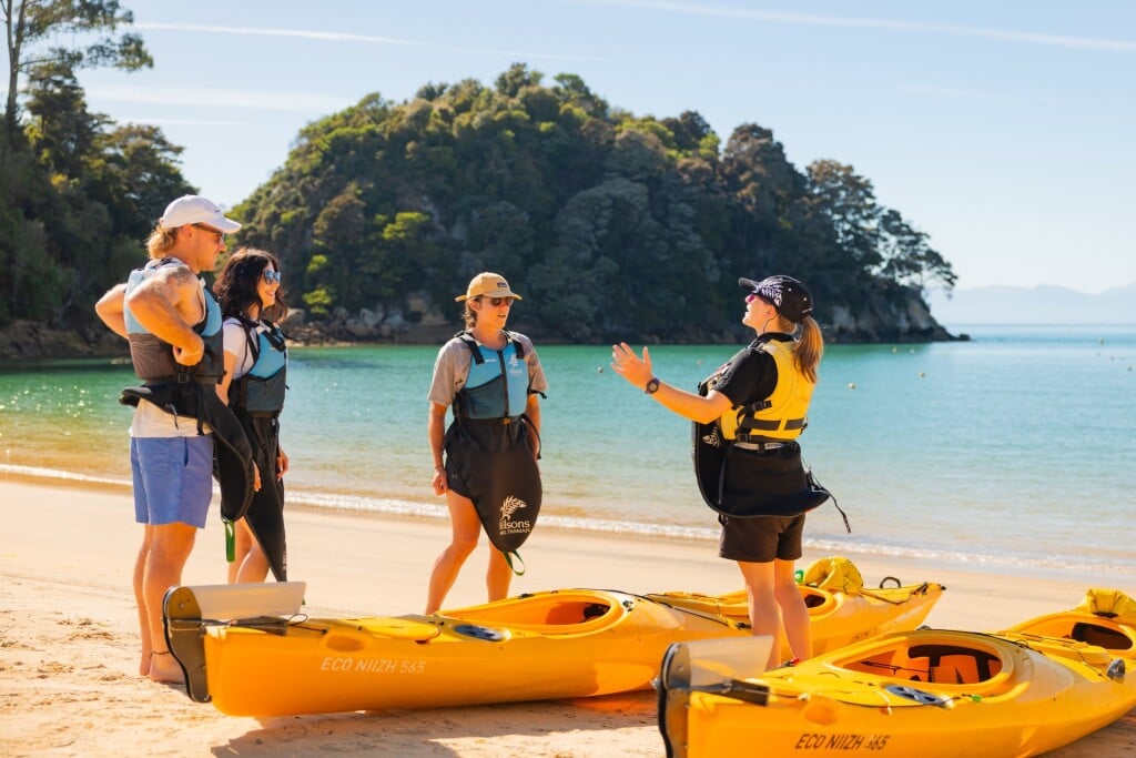 A relaxed start on the sand with your guide before the paddle begins.