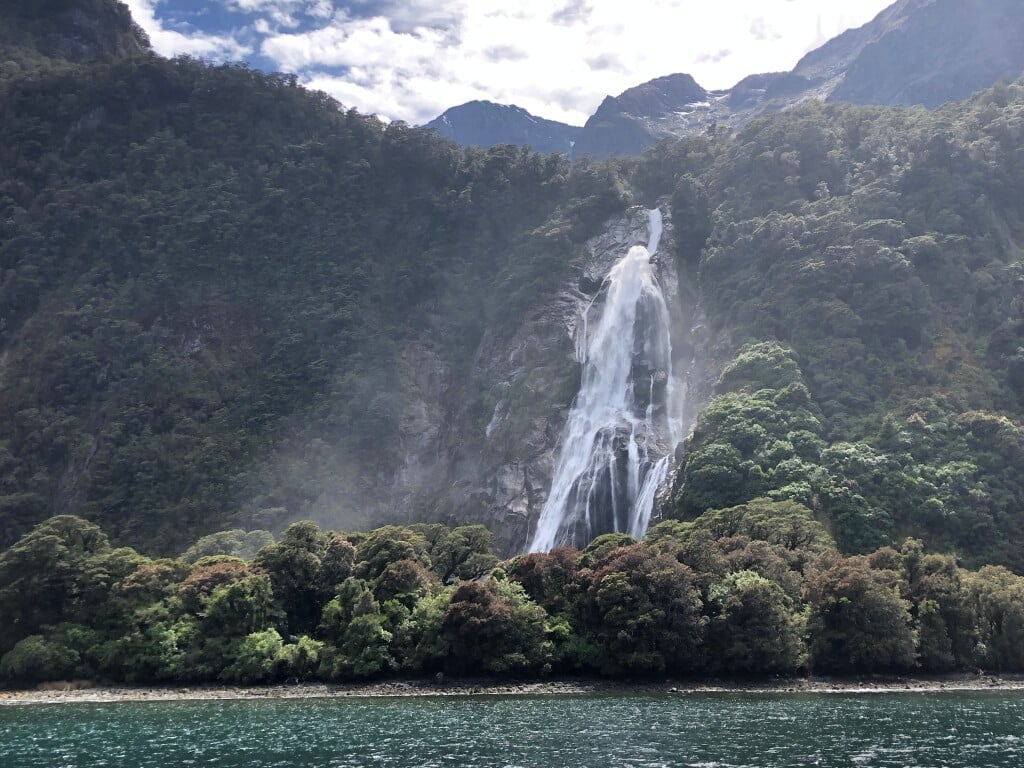 Enjoy up-close views of sheer cliffs, tumbling waterfalls form your boat in Milford Sound.