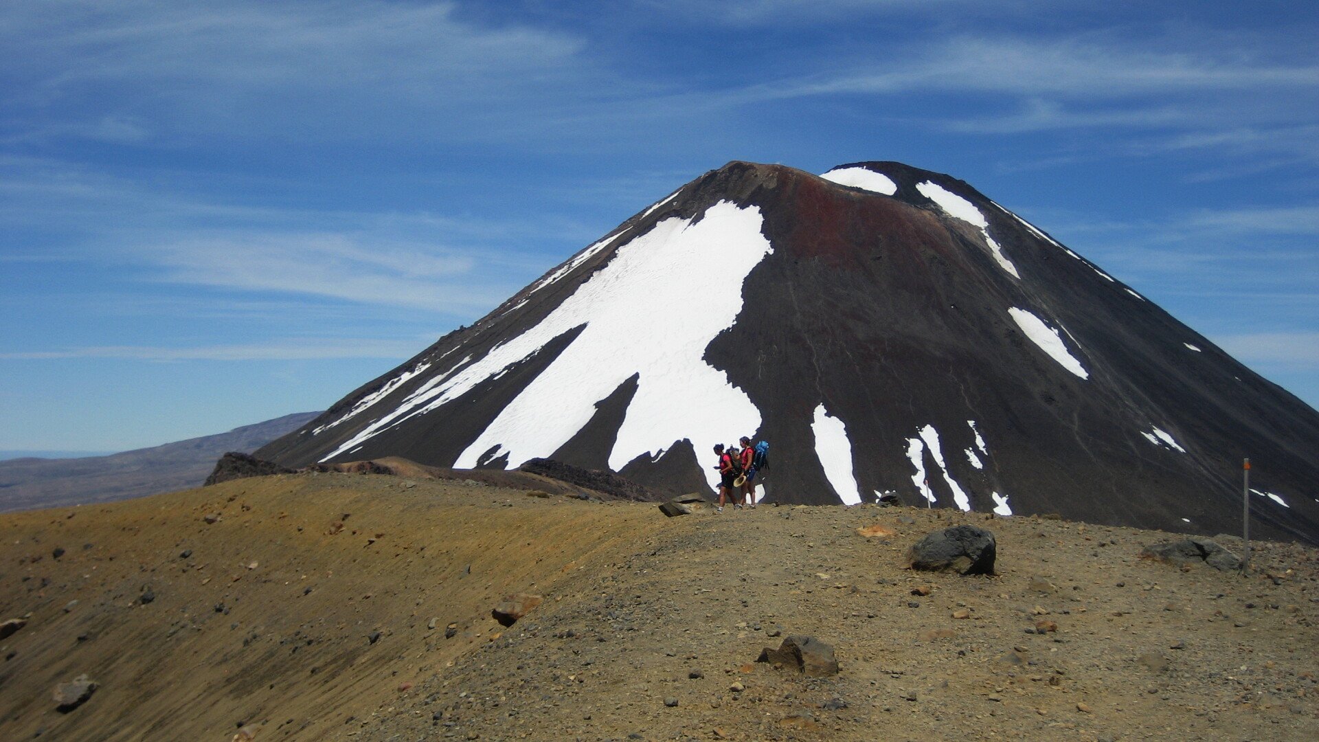 Hikers in front of impressive Mt Ngauruhoe.