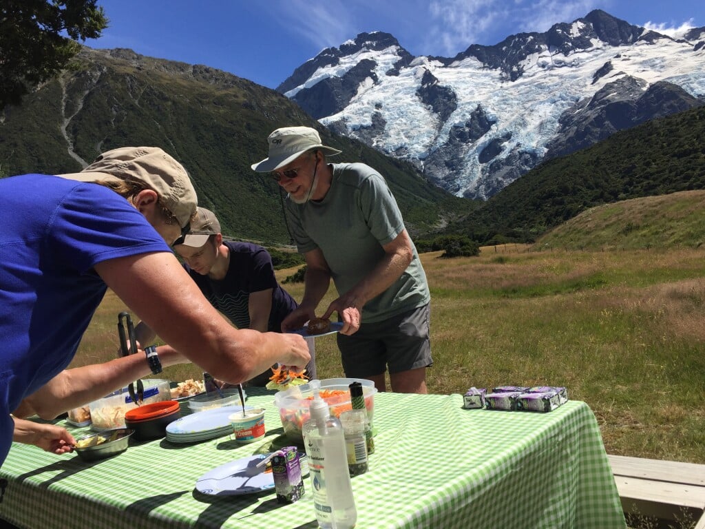 A typical run-and-grab lunch (with fine tablecloth!),  Mt Sefton's icefalls behind