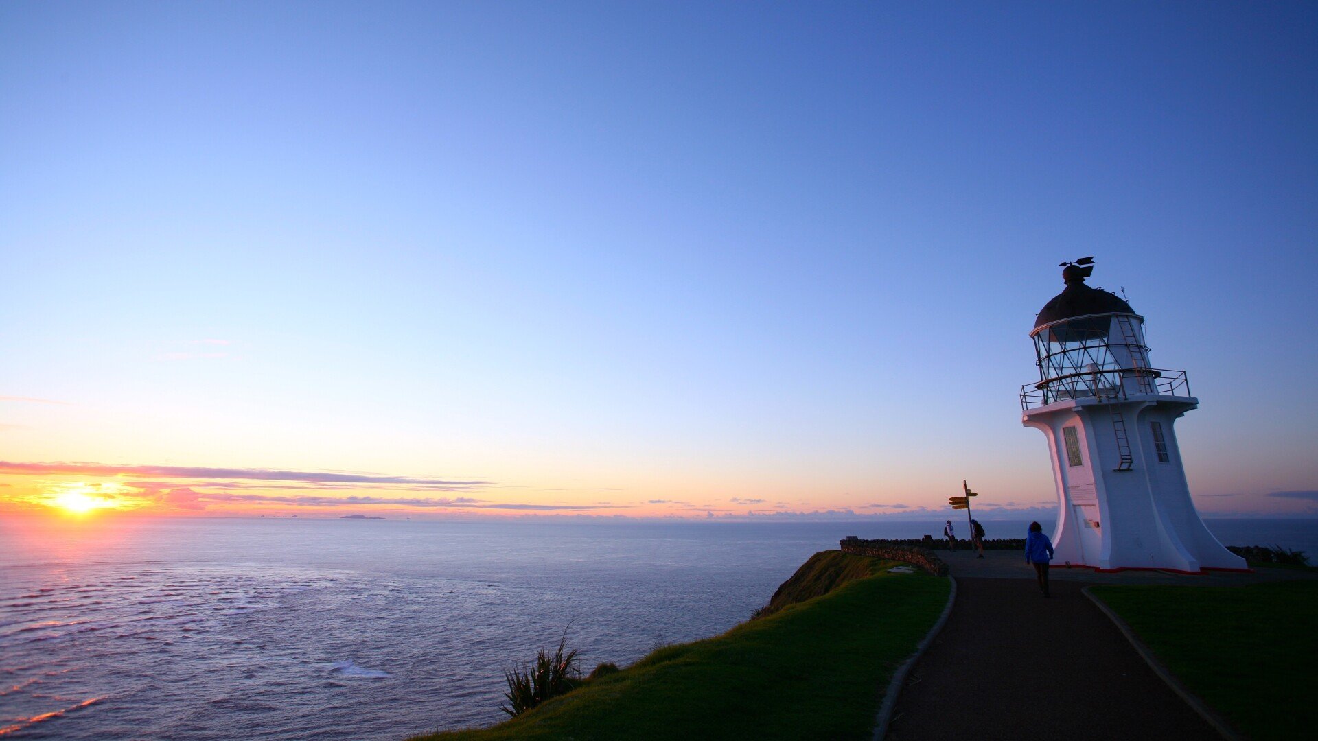 Cape Reinga's lighthouse and the demark stretching north defining where the Tasman and the Pacific meet.
