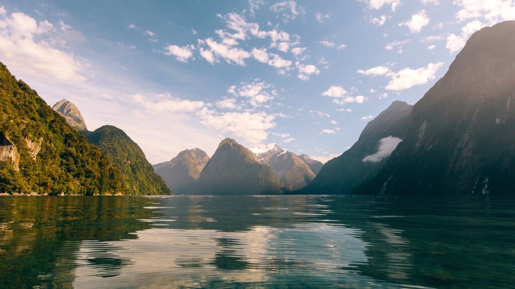 Milford Sound is a world renowned natural wonder with cascading waterfalls and towering peaks.