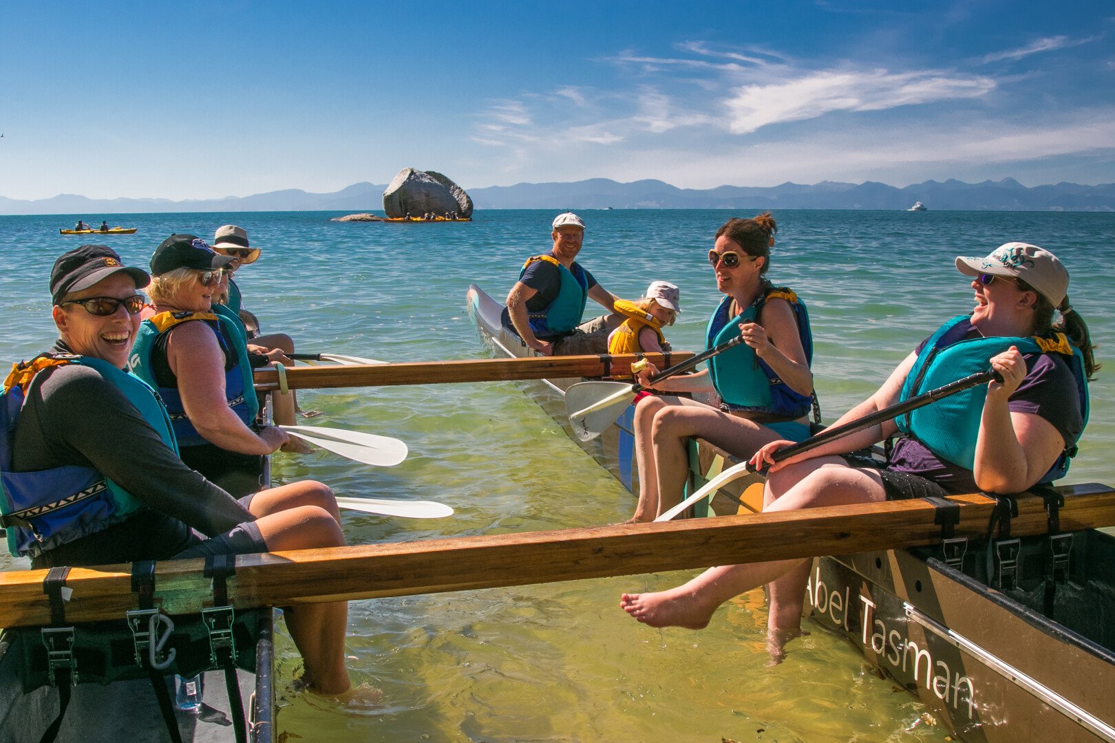 Work as a team as you paddle a waka (Māori canoe) in Abel Tasman National Park.