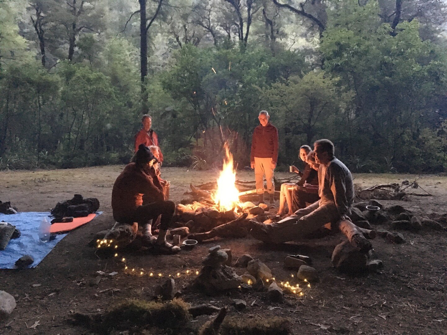 Share stories around the campfire with new friends after an exciting day of hiking.